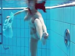 Hot teen unterwasser swims and strips