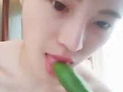Young Chinese stewardess use cocumber for masturbation
